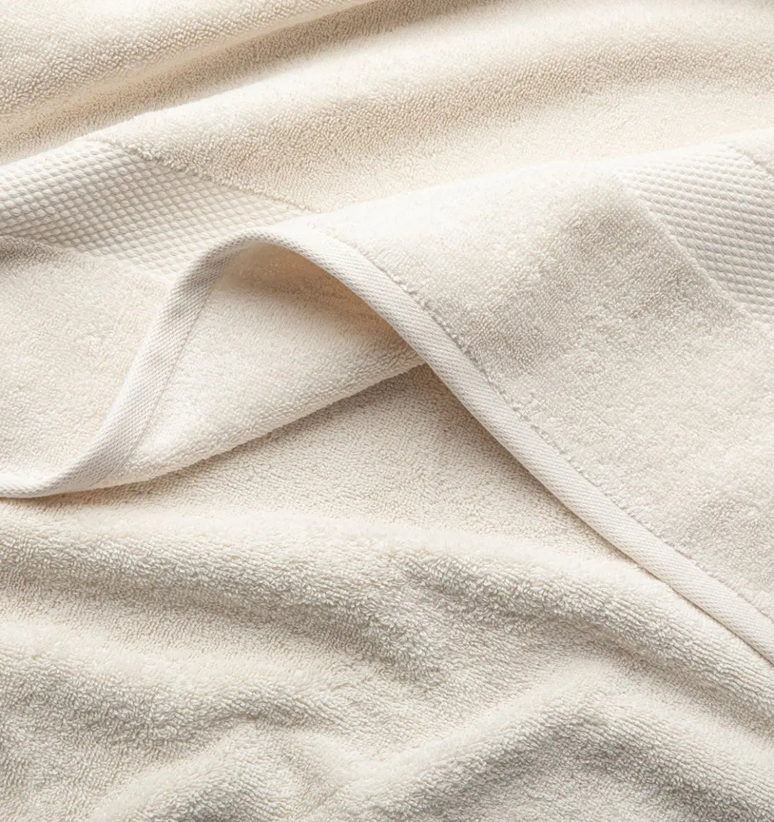 Close-up of beige Premium Turkish Cotton towel with a textured pattern