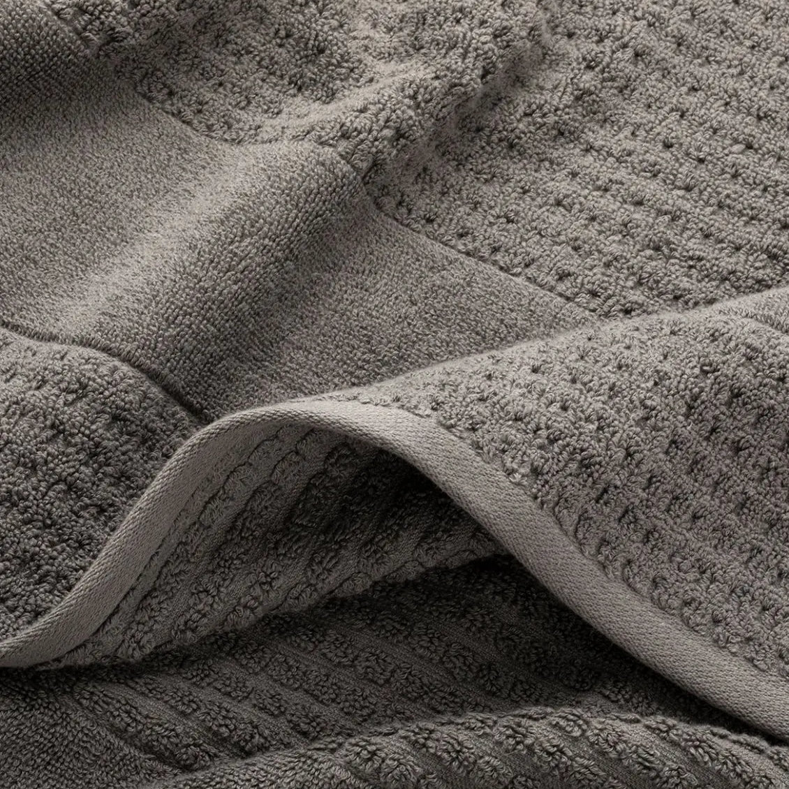 Close-up of textured gray waffle towel fabric