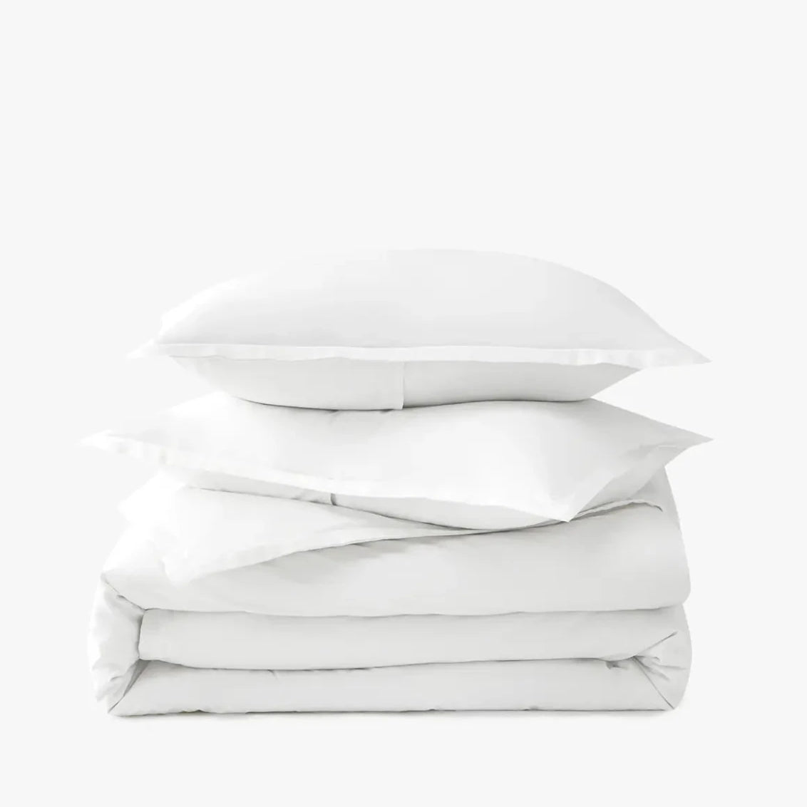 Stack of white duvet cover set on a white background