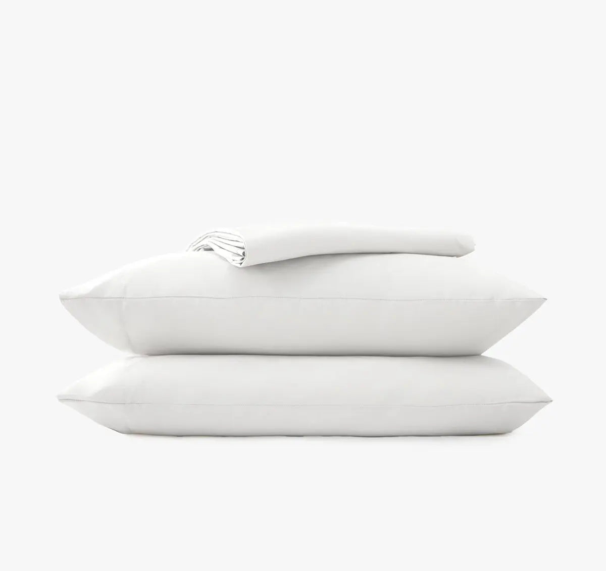 Stack of white pillow cases and sheets on a white background