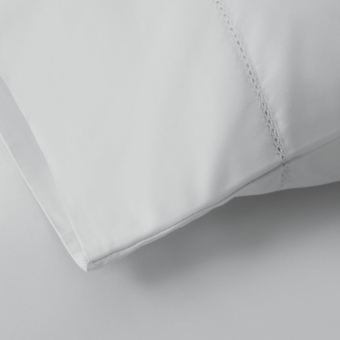 Signature Hemstitch Organic Pillowcase Set Tin Detail | Duman Home