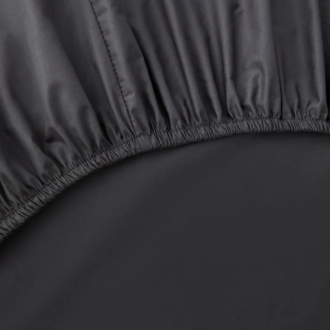 Close-up of a slate gray fitted sheet