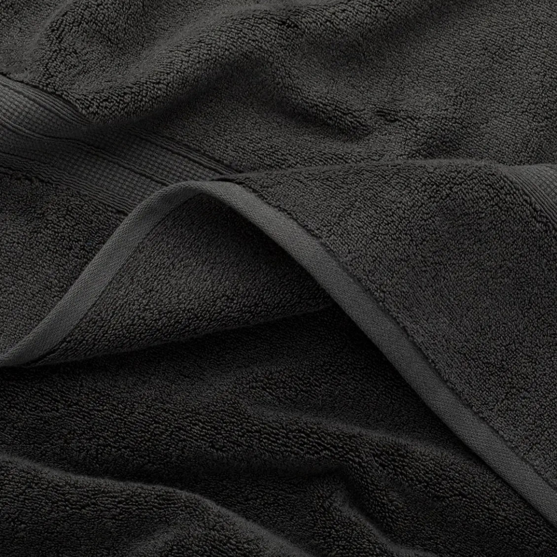 Close-up of a dark gray coal towel with visible texture