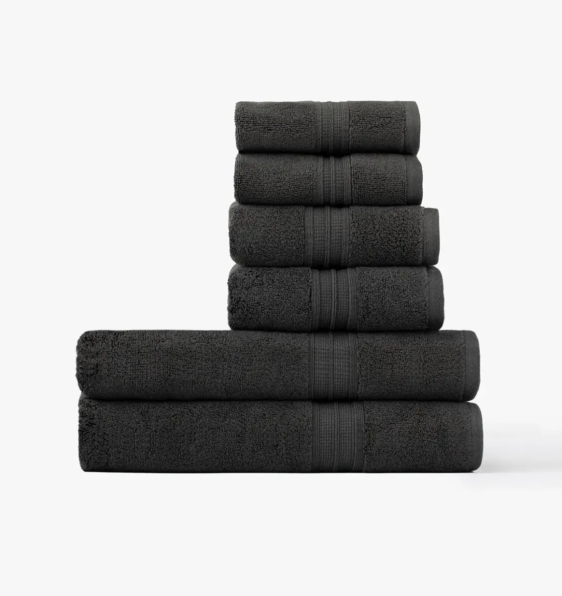 Stack of Super plush Towel bundles in dark grey coal color on a white background