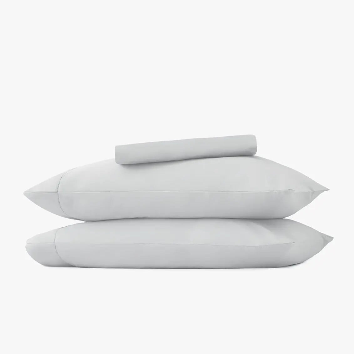 Set of two pillowcases and light gray sheet set on a white background