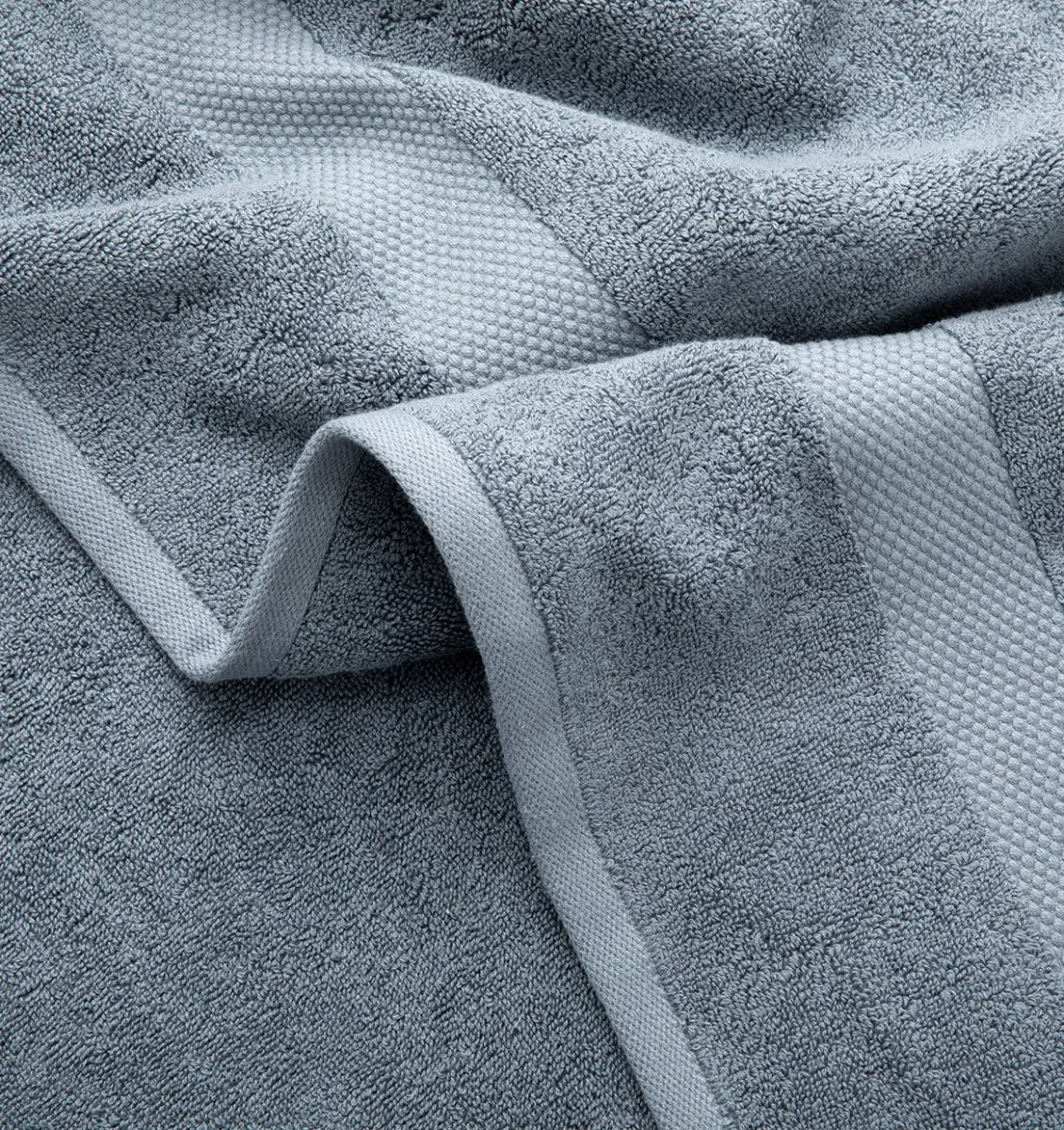 Close-up of a textured blue Premium Turkish Cotton towel with a soft finish