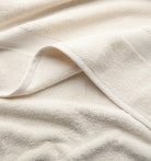 Close-up of beige Premium Turkish Cotton towel with a textured pattern