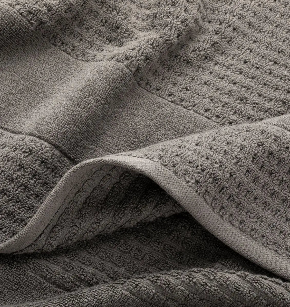 Close-up of textured gray waffle towel fabric 