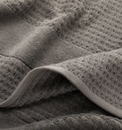 Close-up of textured gray waffle towel fabric 