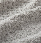 Close-up of light gray waffle towel fabric texture