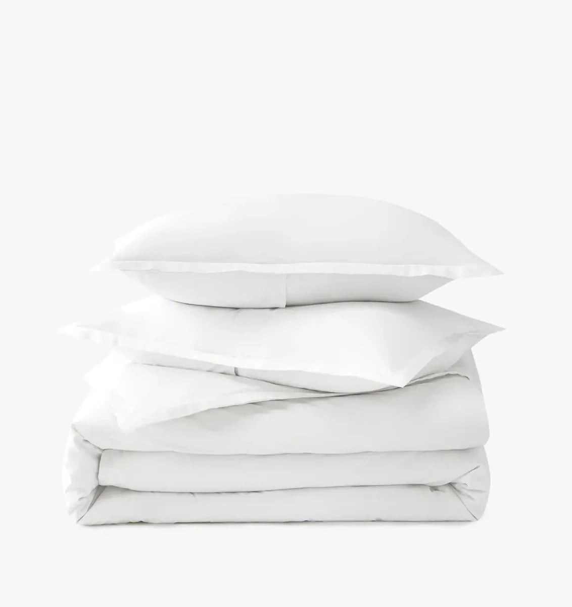 Stack of white duvet cover set on a white background