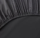 Close-up of a slate gray fitted sheet 