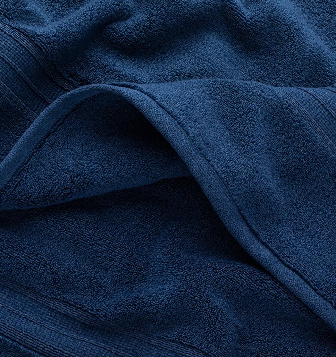 Close-up of a navy blue super plush towel with texture details