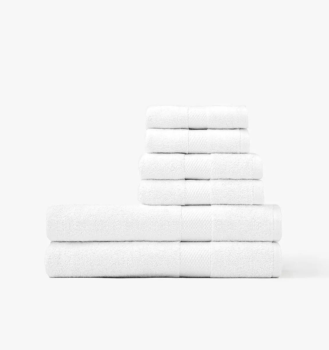 Stack of white Turkish cotton towels on a white background
