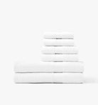 Stack of white Turkish cotton towels on a white background