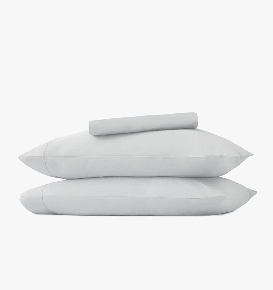 Set of two pillowcases and light gray sheet set on a white background